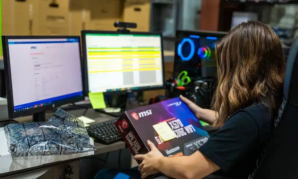 PowerGPU technician assembling a gaming PC