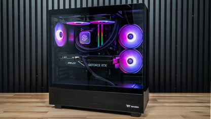 Night Hawk gaming PC front view showing tempered glass, RTX 5070 Ti graphics card, 240mm liquid cooler and purple RGB lighting