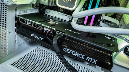 Close-up of the PNY GeForce RTX 5070 Ti 16GB graphics card installed in the Snow Hawk white gaming PC